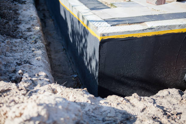 Professional Basement Waterproofing technician working in Robbinsville, NJ